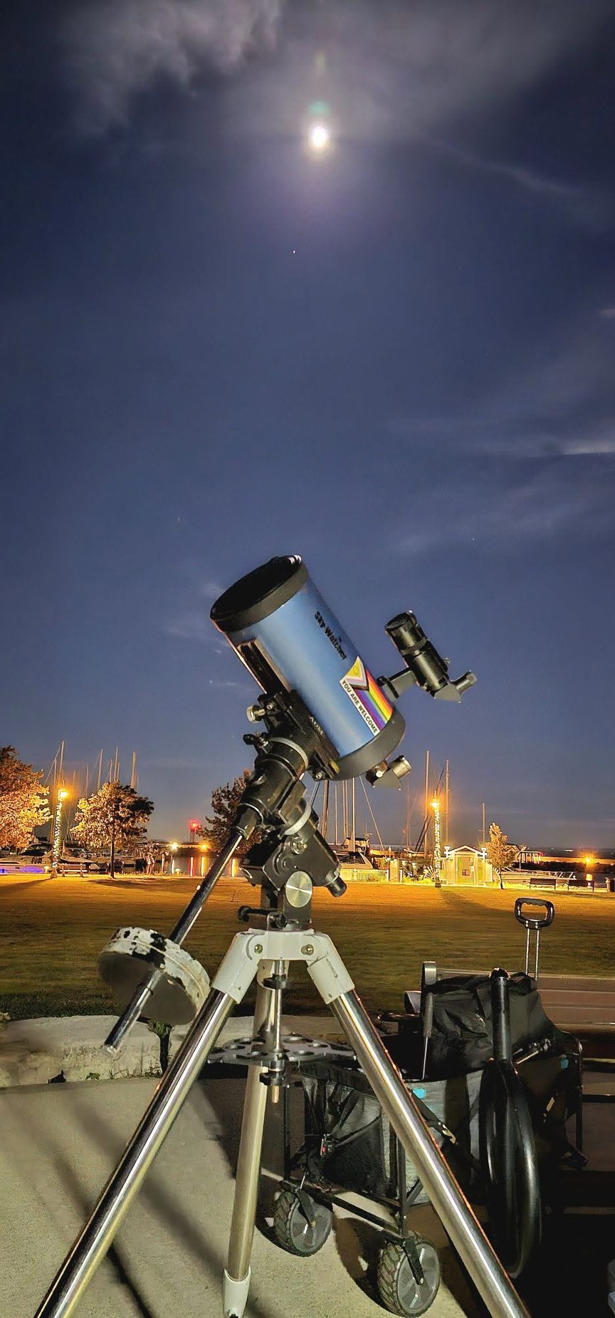 Telescope beneath the evening moon